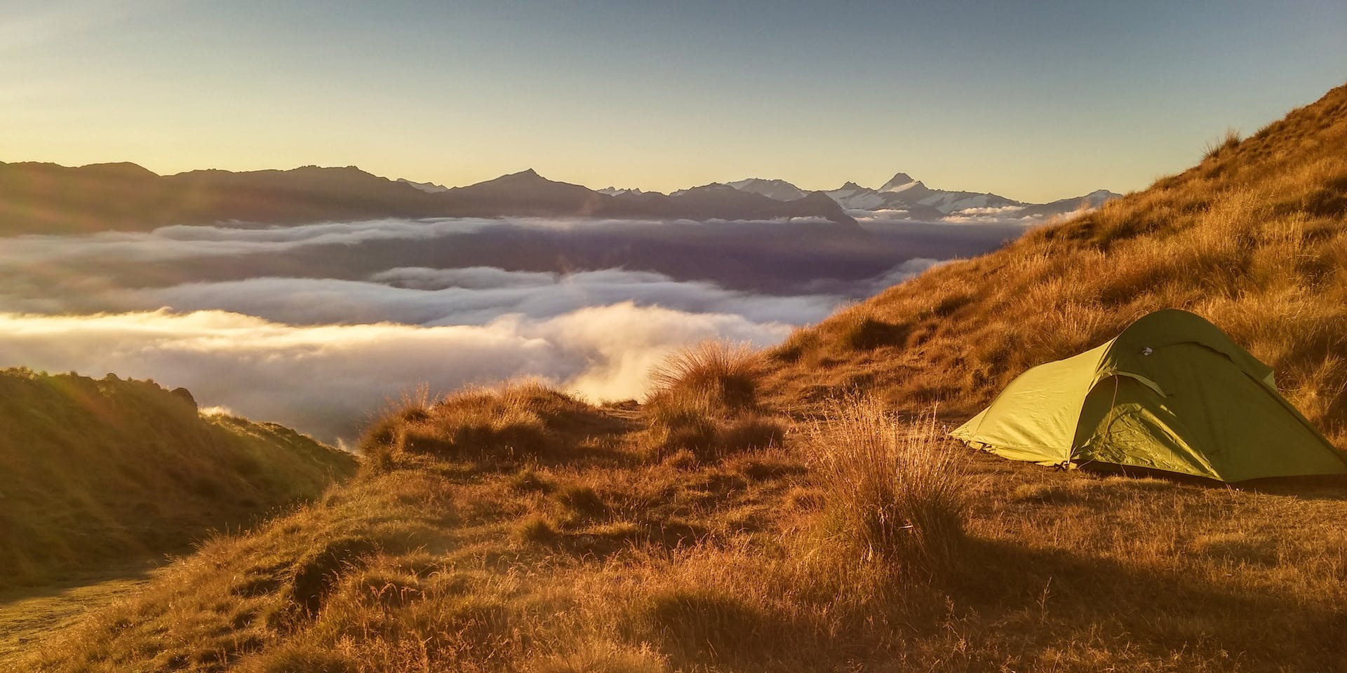 Green Tent On Top Of Mountain